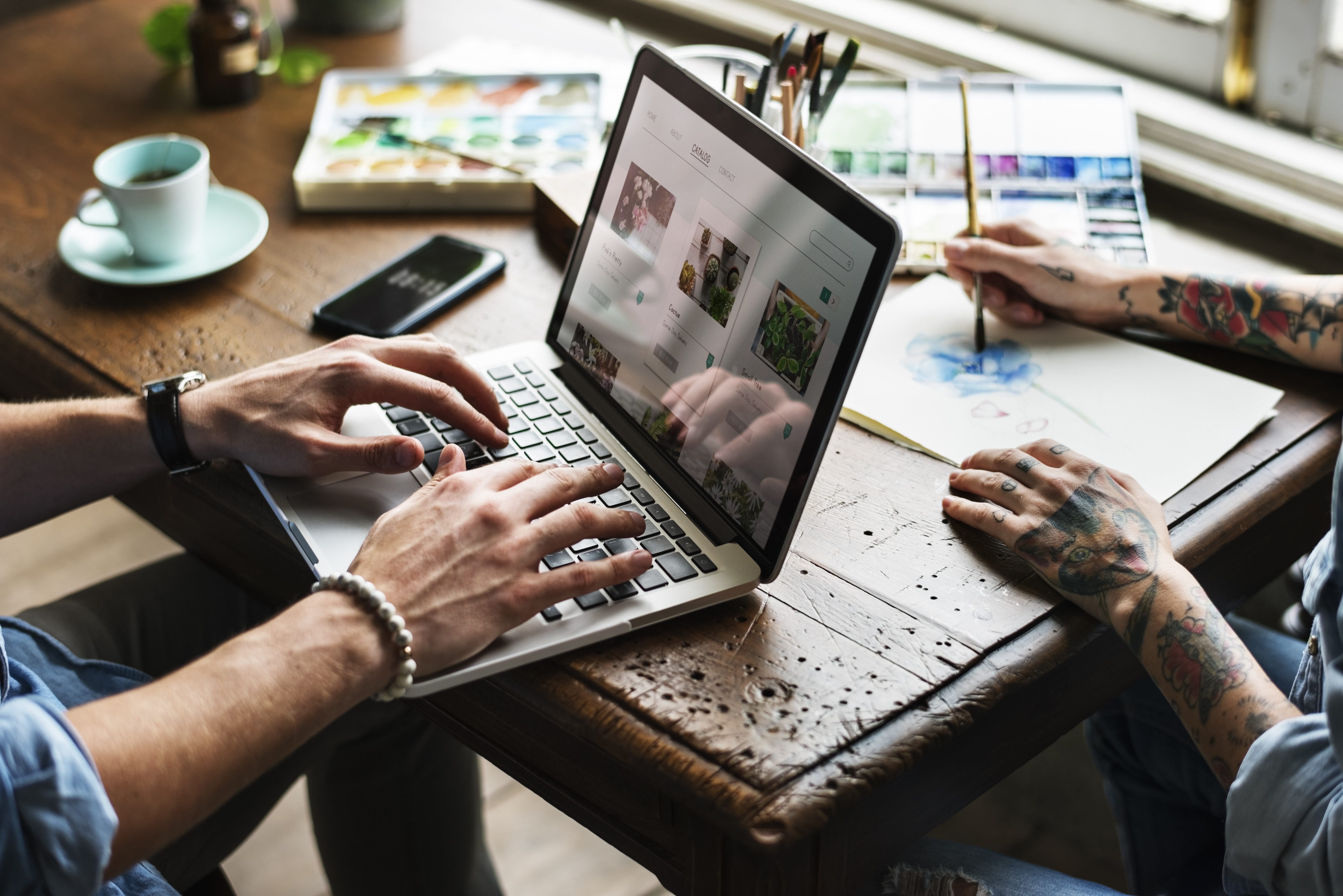 Business professional working at a laptop with analytics data on screen